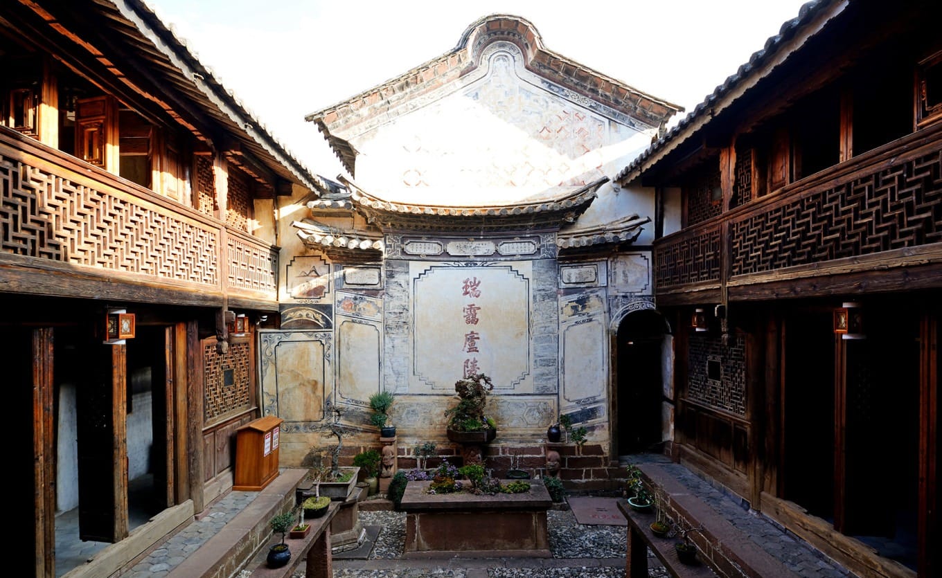 The premium guest quarters with carved wooden doors in Ouyang Courtyard