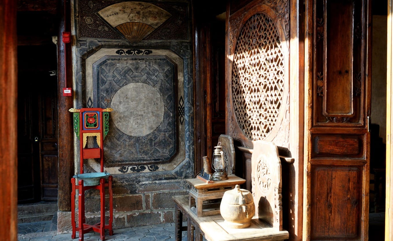 Preserved historical furniture and artifacts inside Ouyang Courtyard