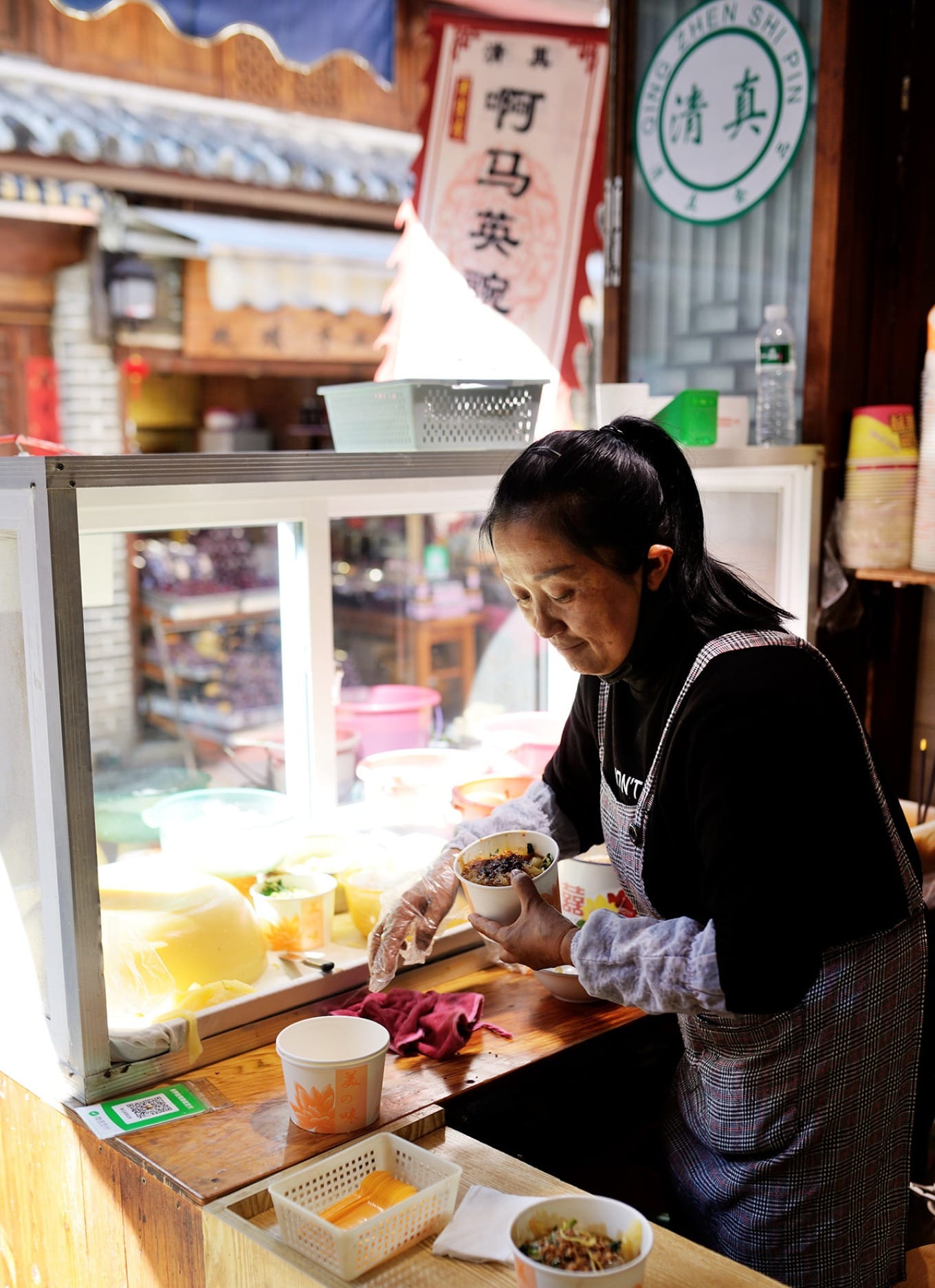 Exterior of A Ma Ying Pea Jelly shop in Xizhou with traditional signage