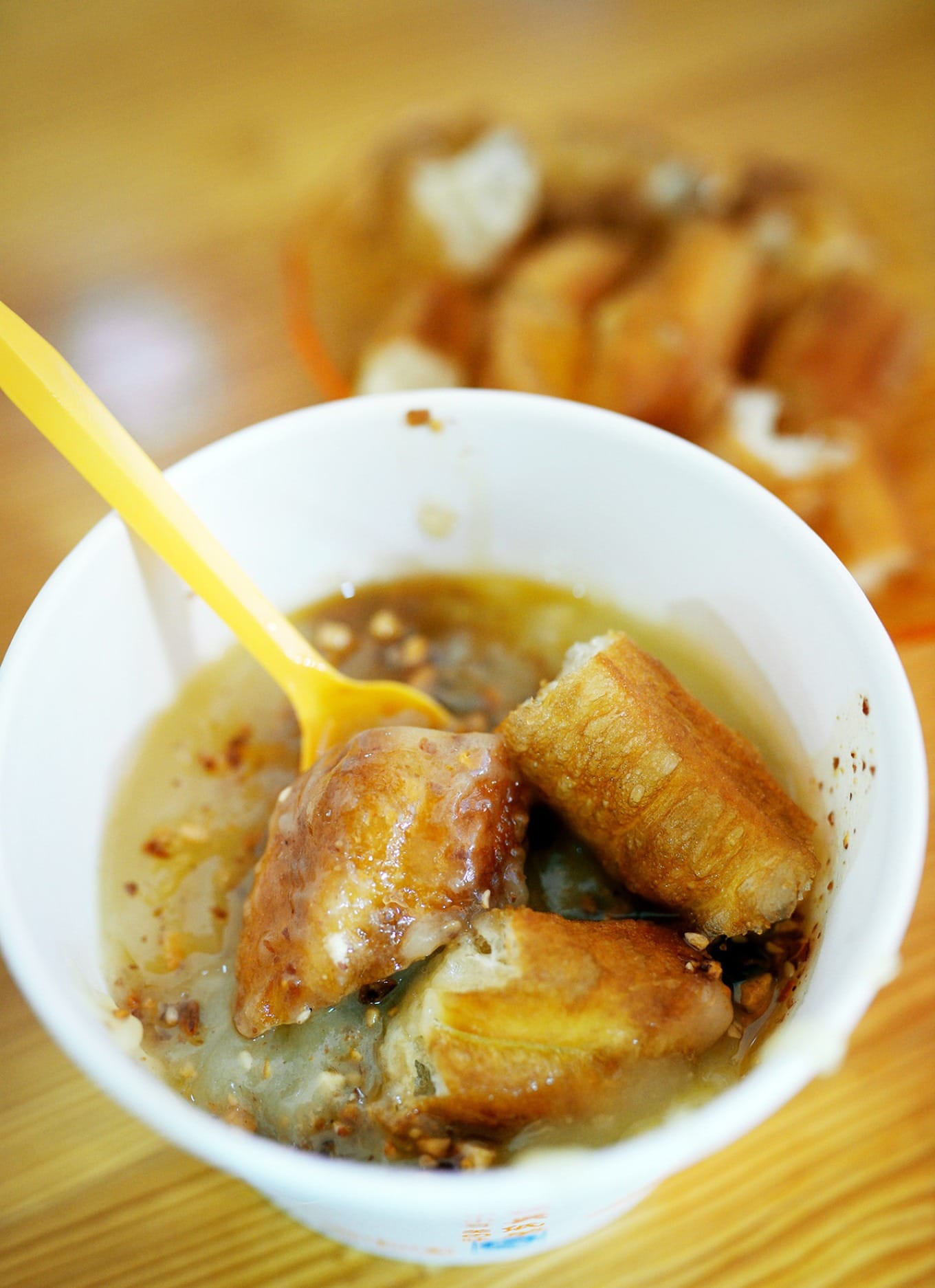 Pea porridge served with youtiao fried dough sticks on the side