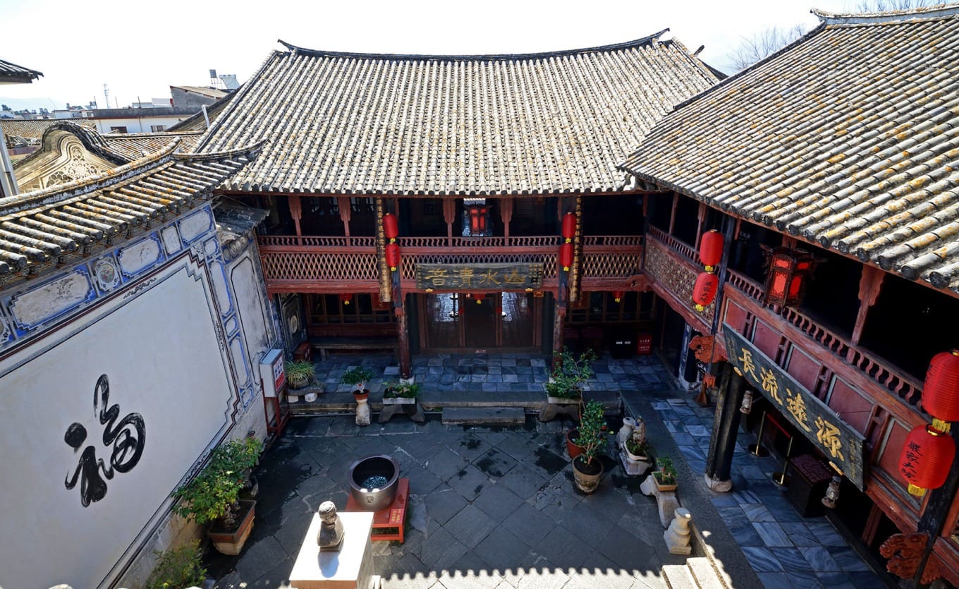 Carved wooden details and window lattices in the courtyard