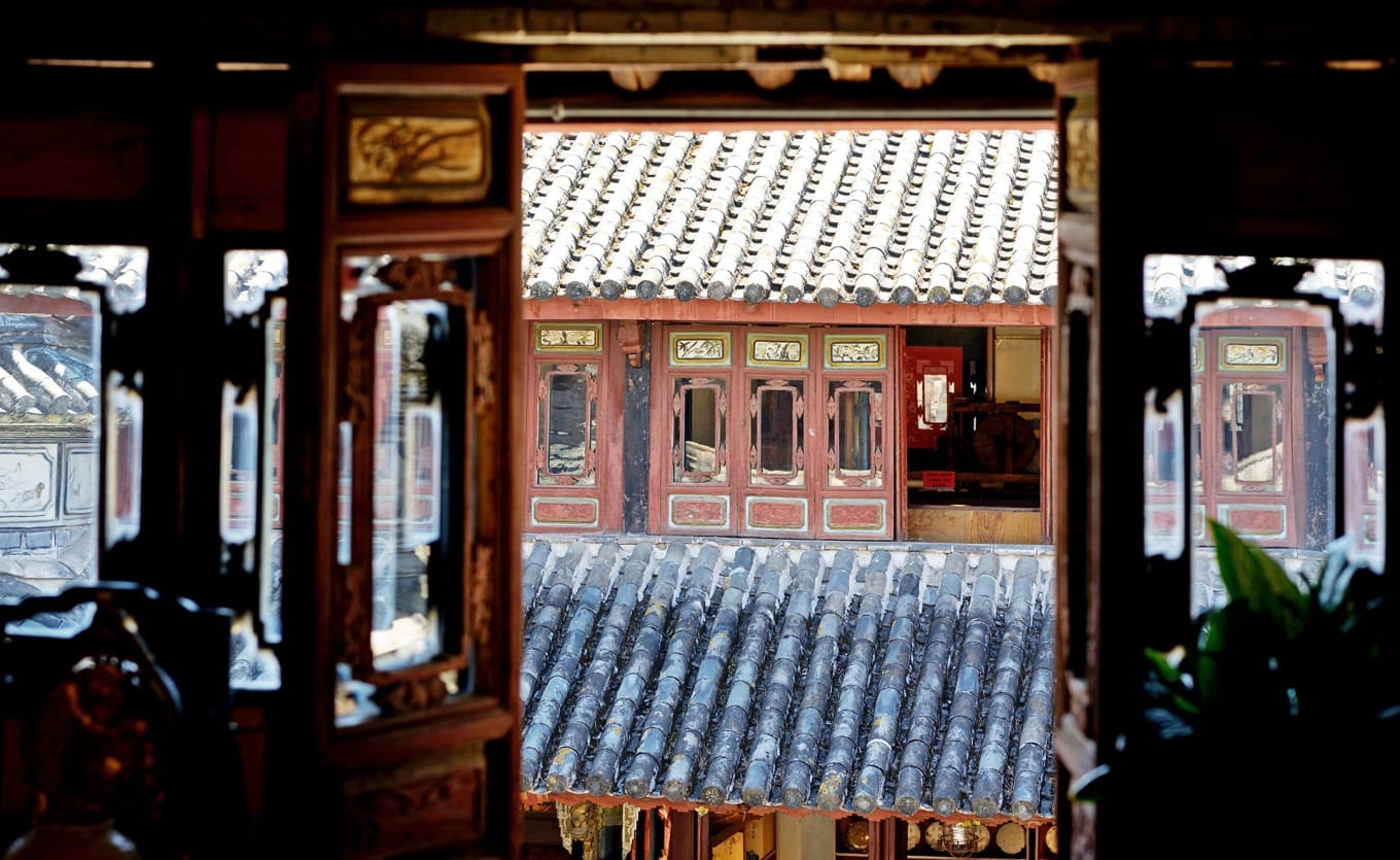 Detailed section of a century-old mural depicting figures and scenery