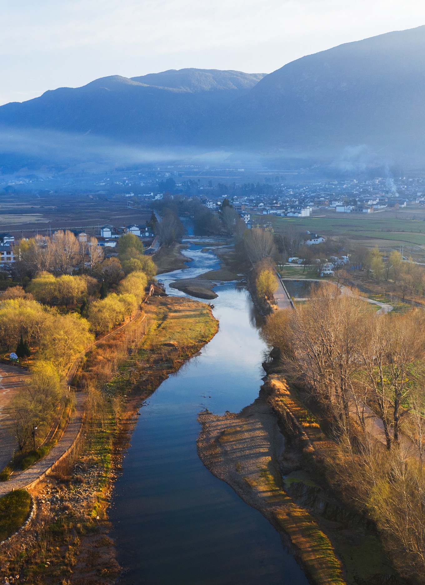 Aerial view of Dali Railway Station with mountains in the background