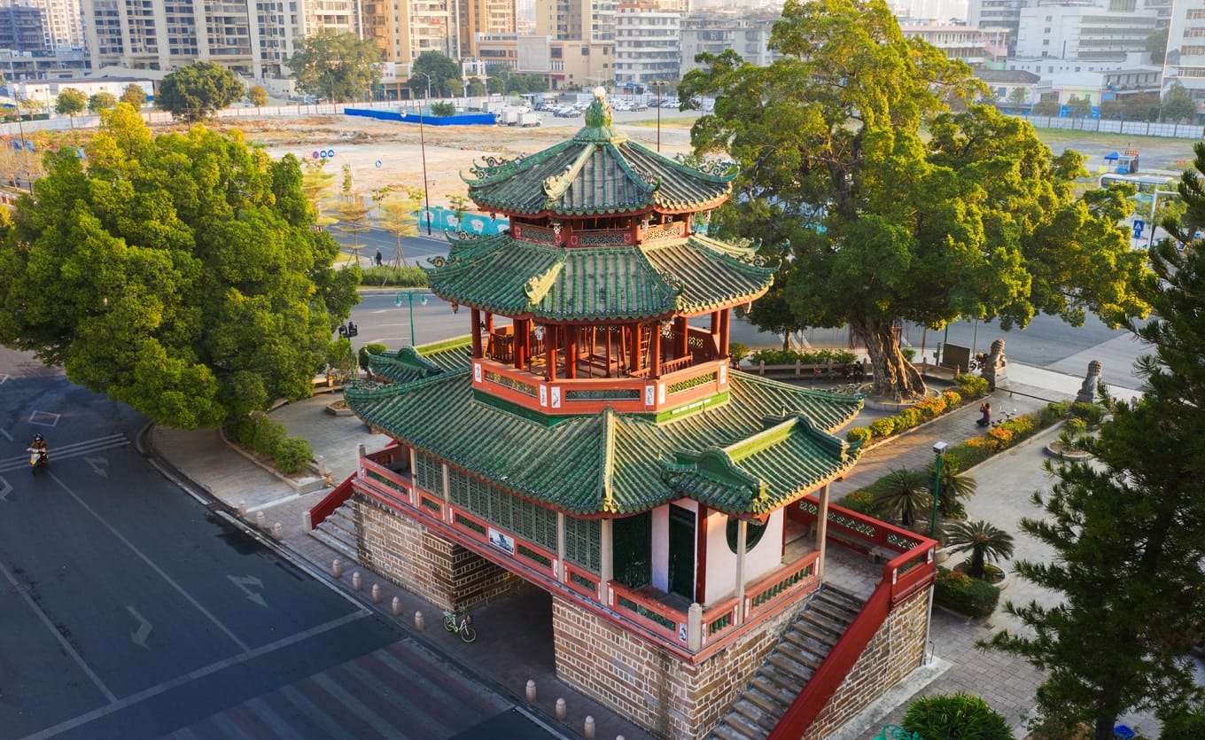 Detailed view of Jinxian Gate's multi-tiered traditional roof and stone archway