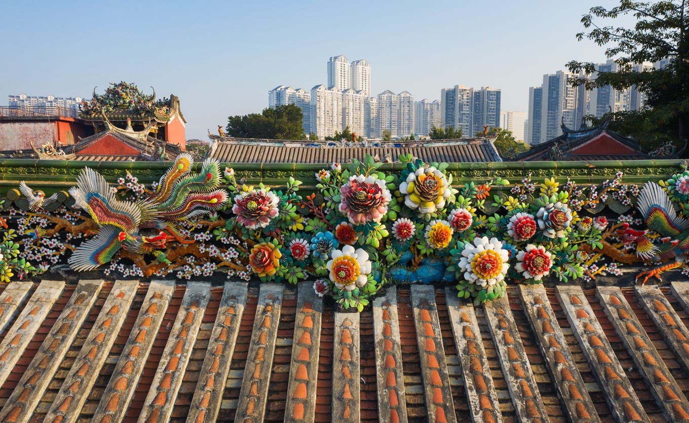 Intricate Chaoshan ceramic mosaic decorations on temple roof ridges