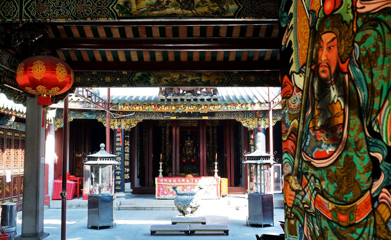 Close-up of Lei Shen Temple's colorful door god paintings with Chinese calligraphy inscriptions