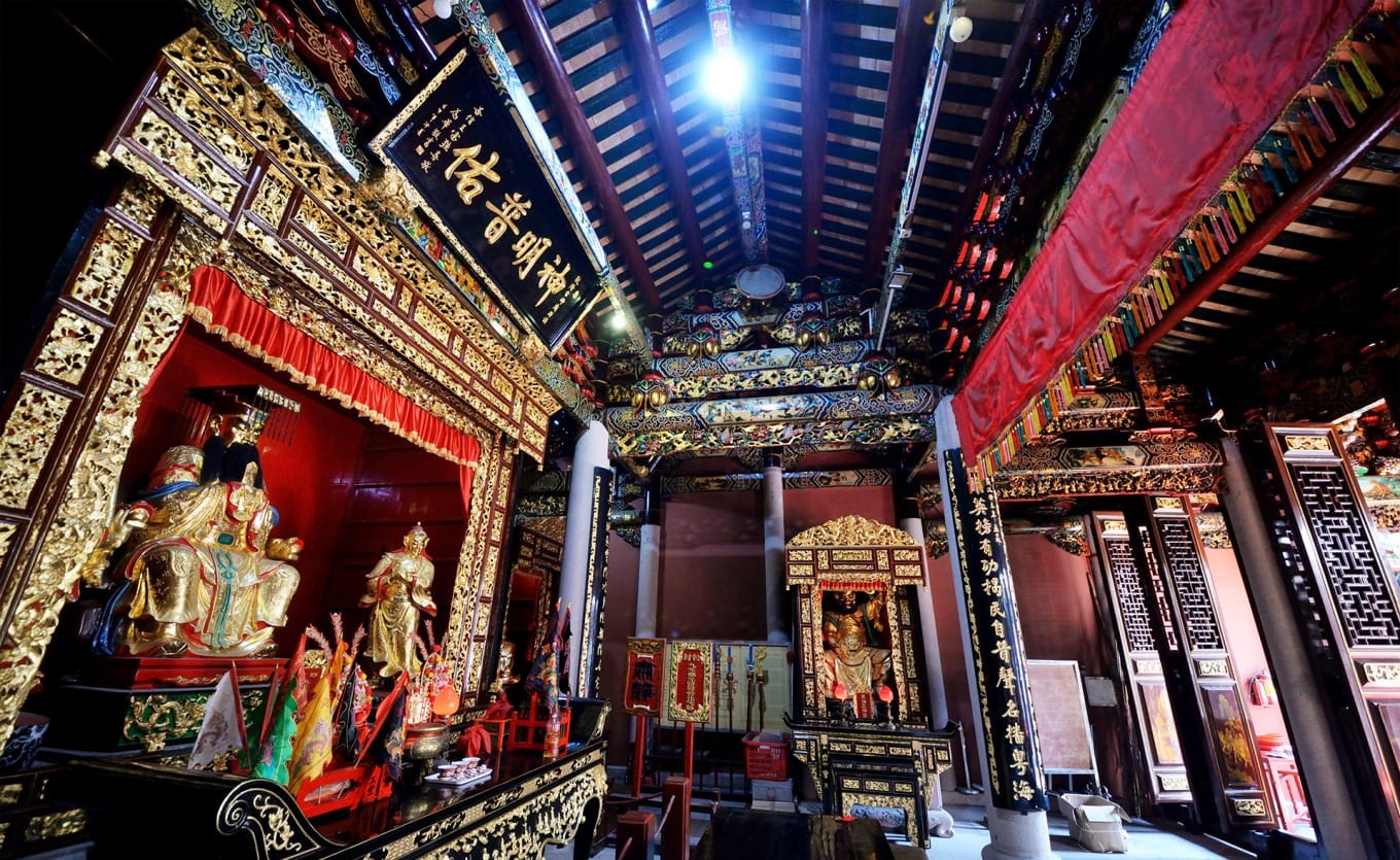 Interior shrine of Lei Shen Temple with central Thunder Ancestor statue and flanking weather deity figures