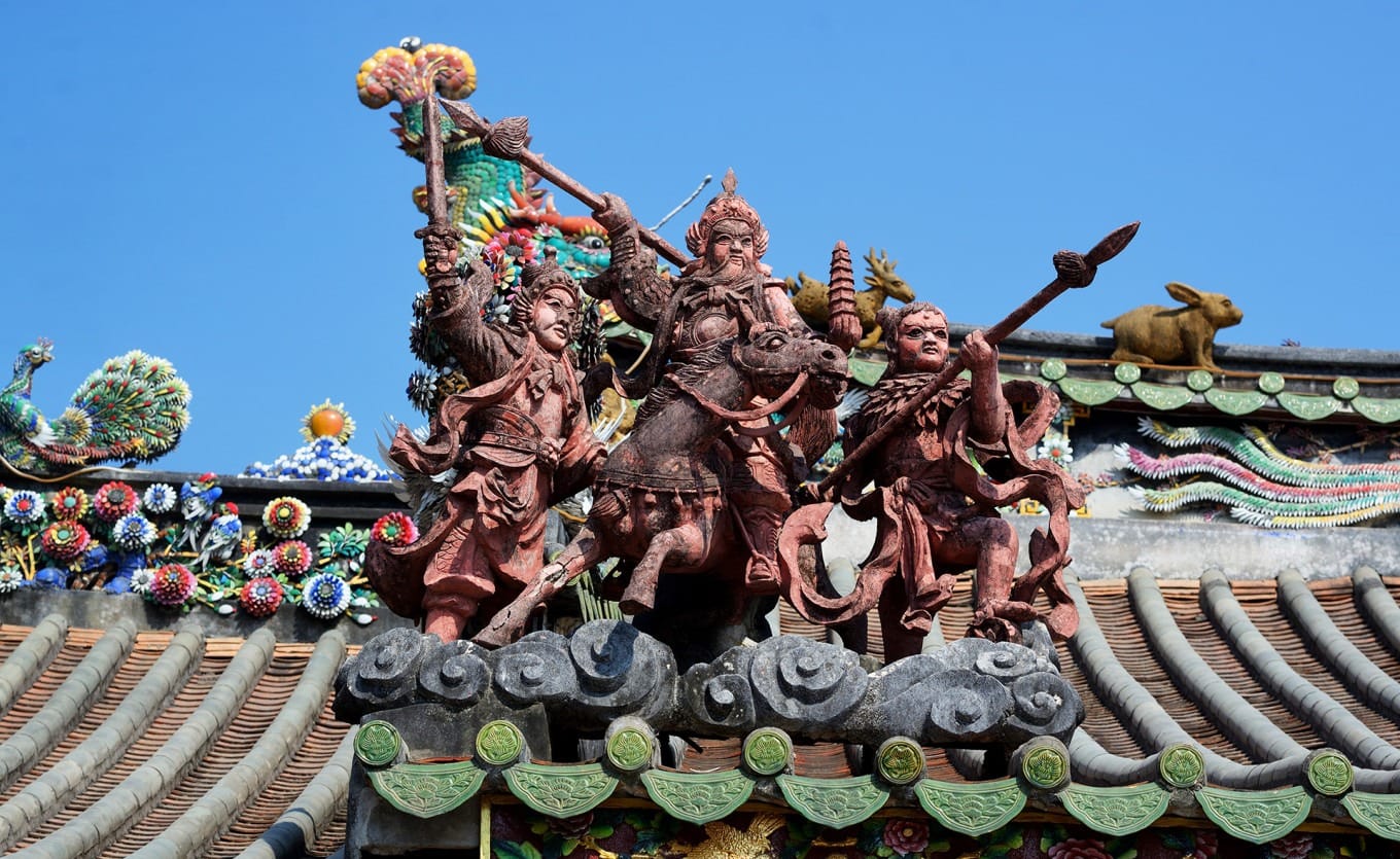 Detailed view of ceramic mosaic and lime sculpture traditional crafts on temple walls and architecture