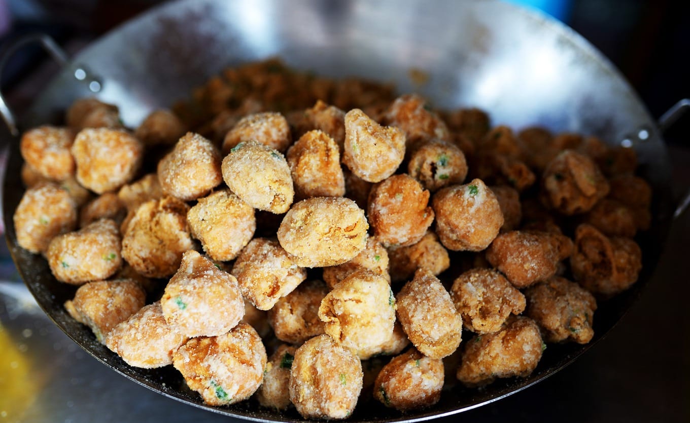 Close-up of sugar-coated salted egg yolks showing crystalline sugar texture