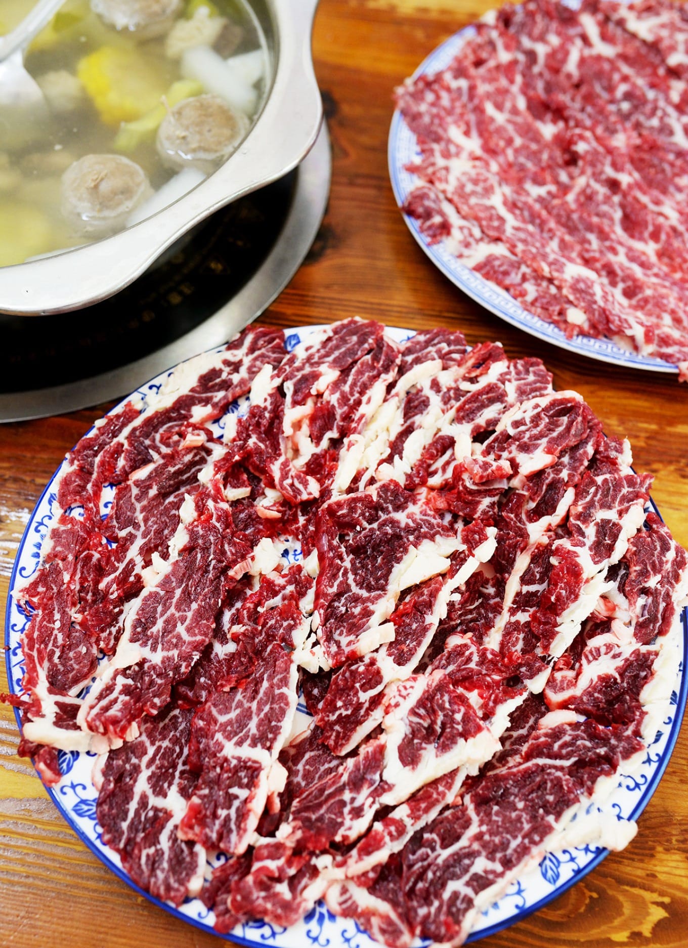 Clear beef bone broth with corn and bitter melon in hotpot