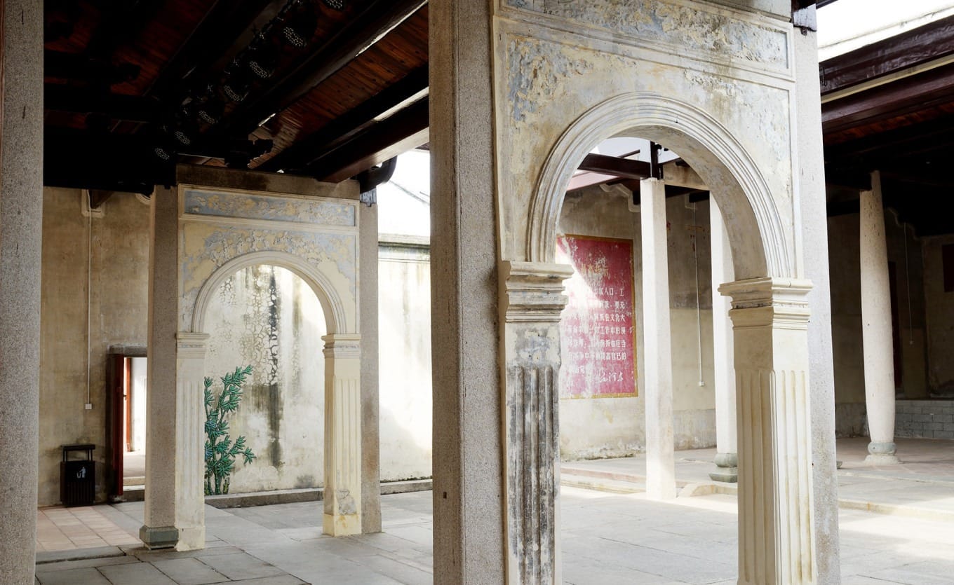 Detailed woodcarvings combining Chinese and Western motifs