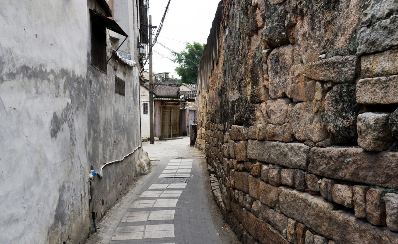 Ancient stone wall of Jieyang Forbidden City behind Sixian Middle School
