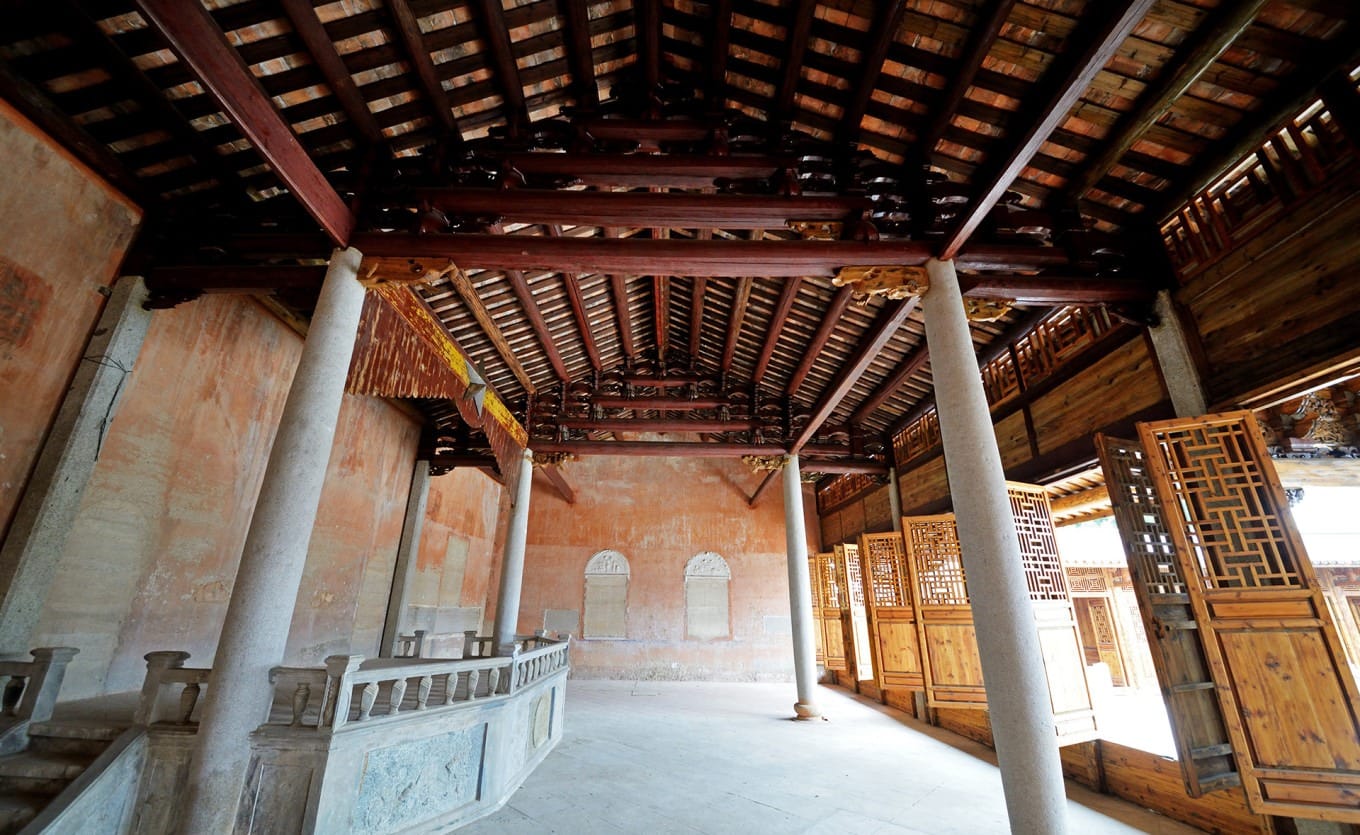 Detailed view of wooden beams and roof structure in Dacheng Hall