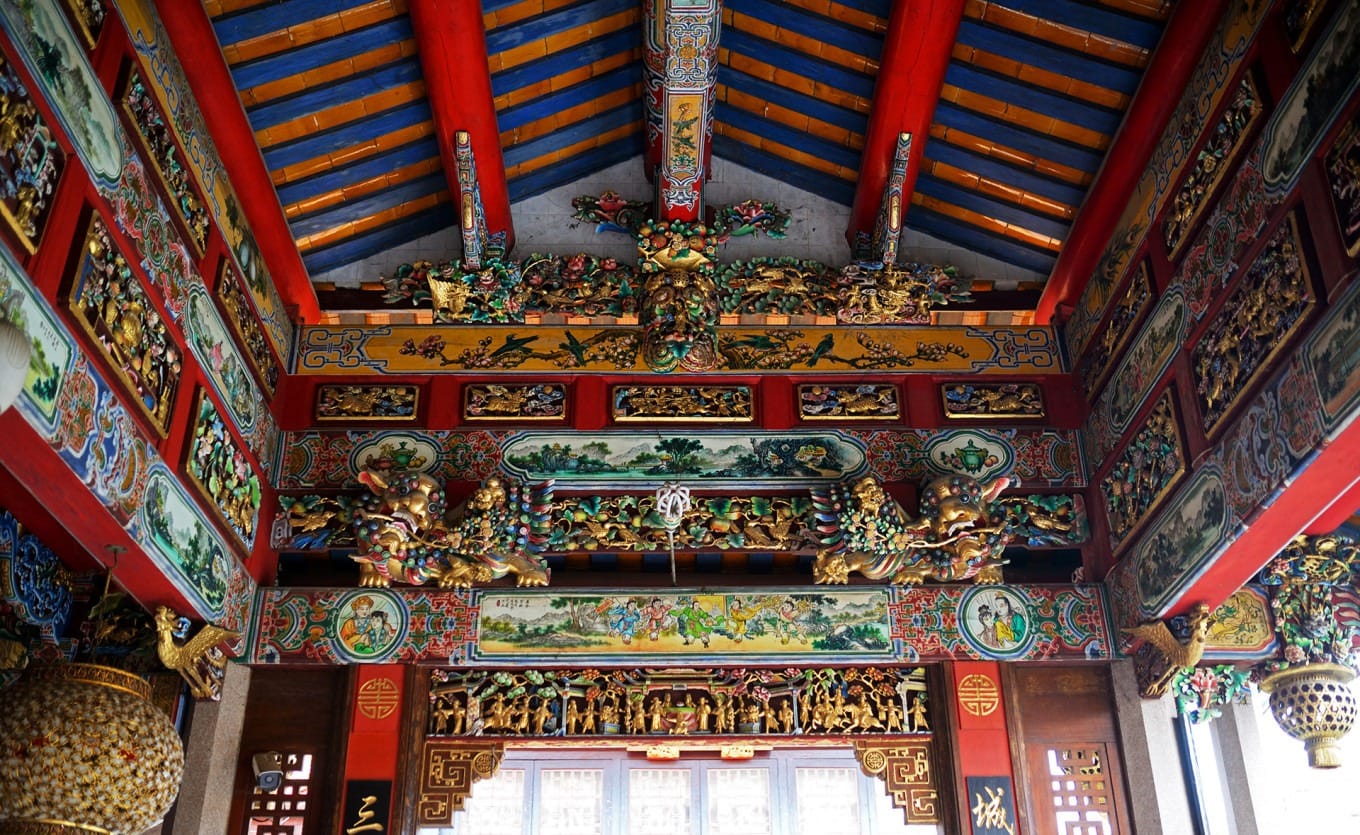 Detailed view of traditional woodcarvings in the temple