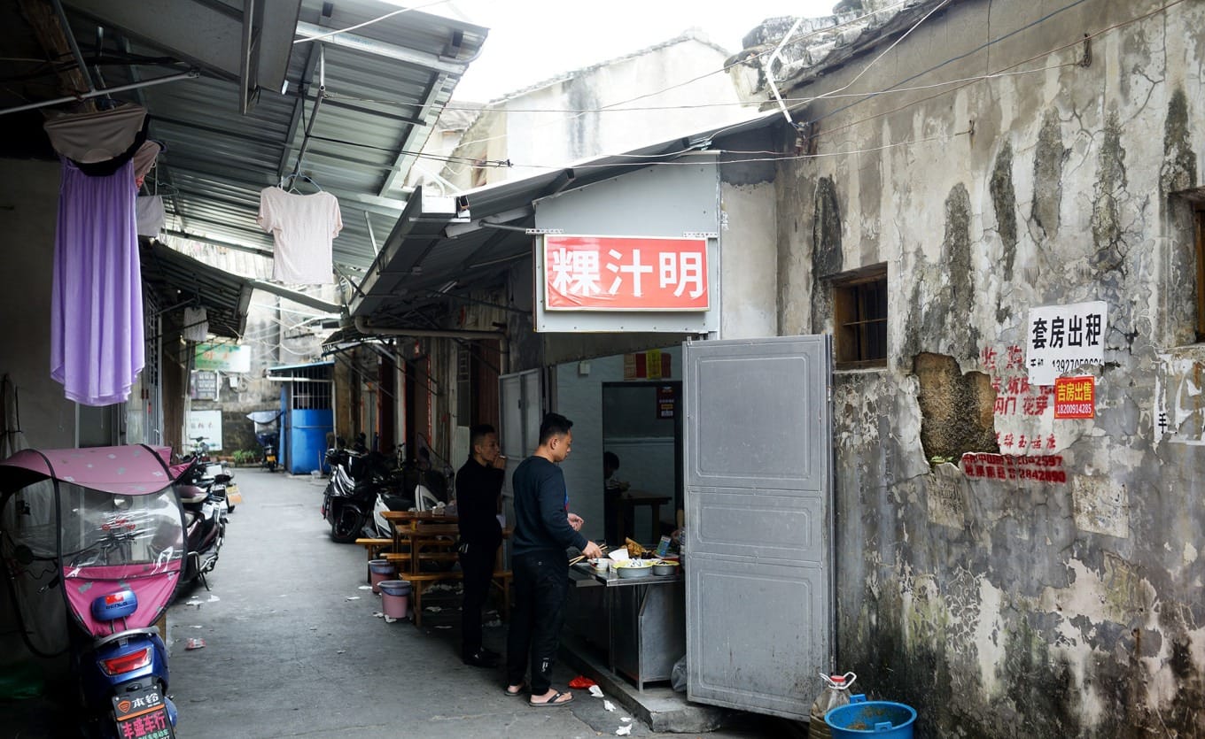 Narrow alley entrance leading to Guo Zhi Ming restaurant beside Hongyang Cinema in Puning