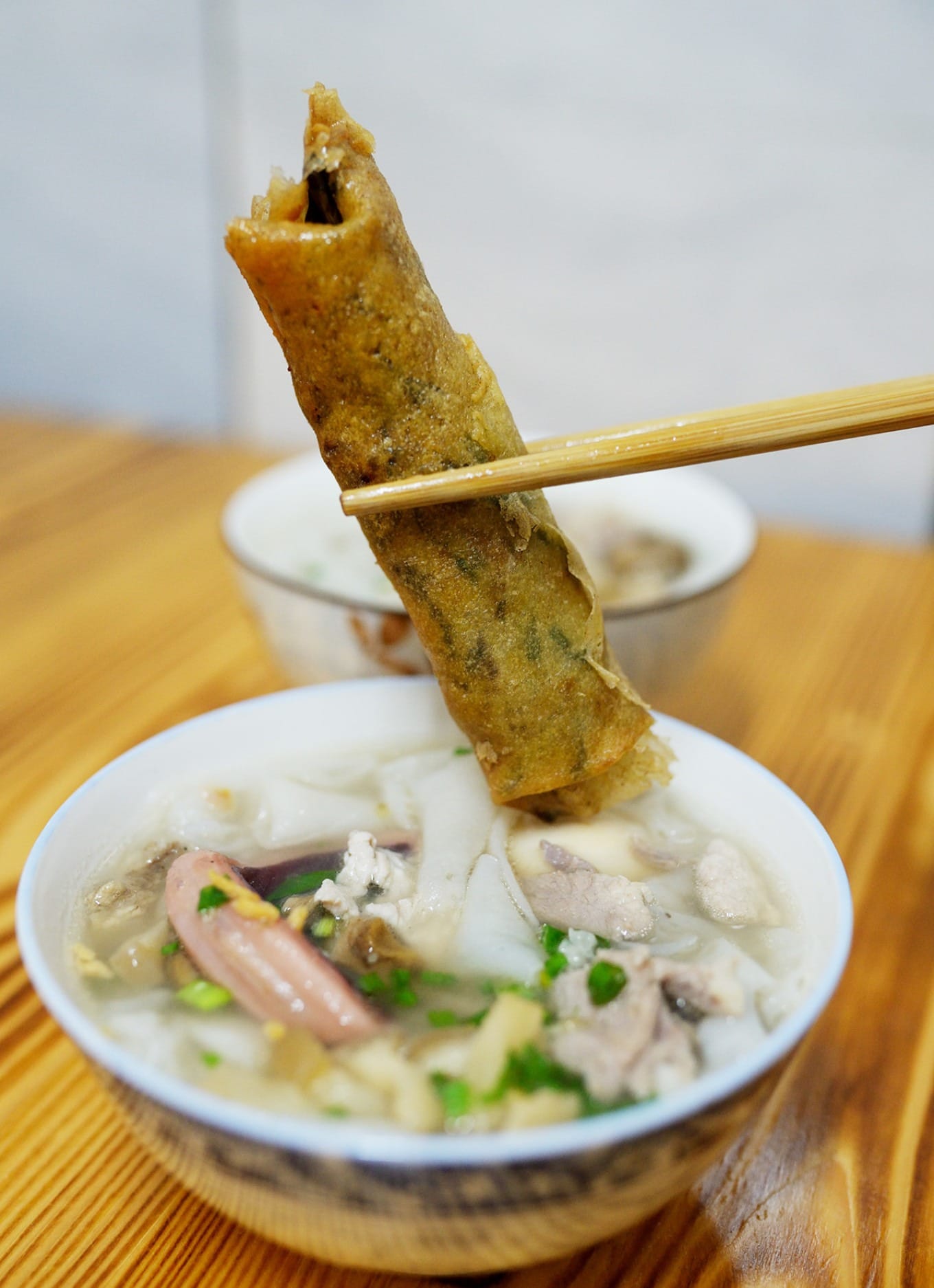 Crispy fried spring roll served as a side dish with Kueh Chup