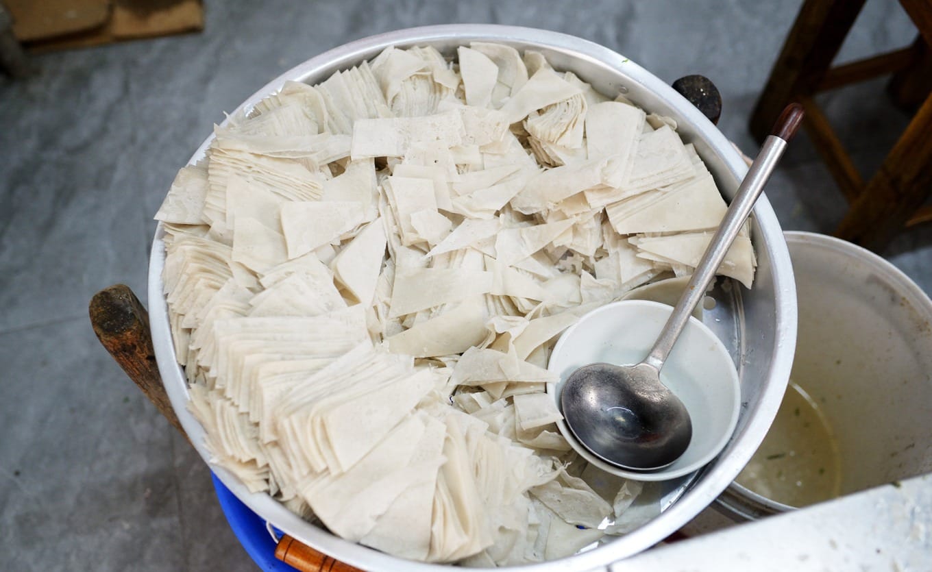 Uncooked kueh chup skin pieces cut into diamond shapes ready for cooking