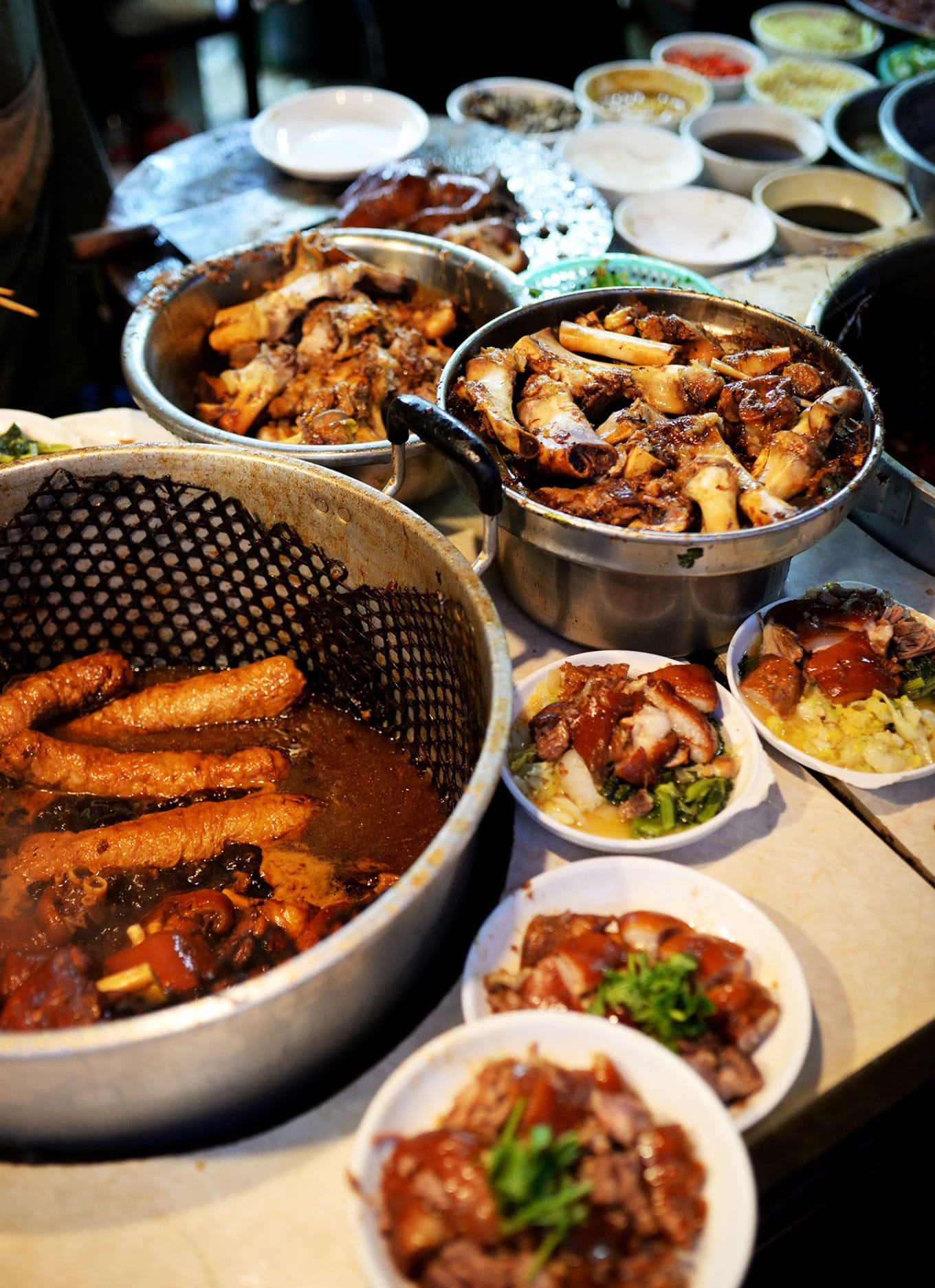 Traditional braising process of pork knuckle in master stock