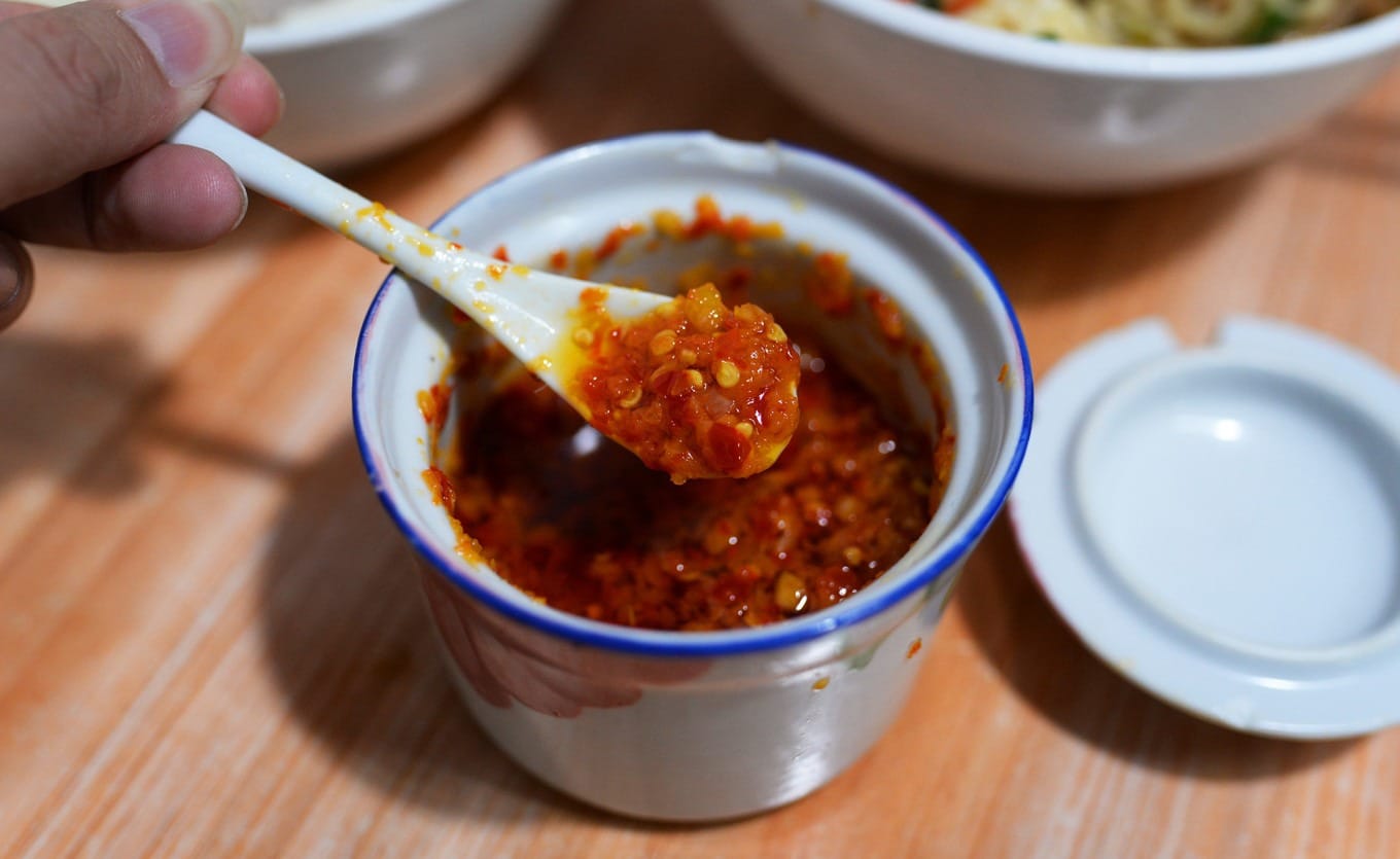 Small bowl of red chili sauce at Xichi Baima restaurant
