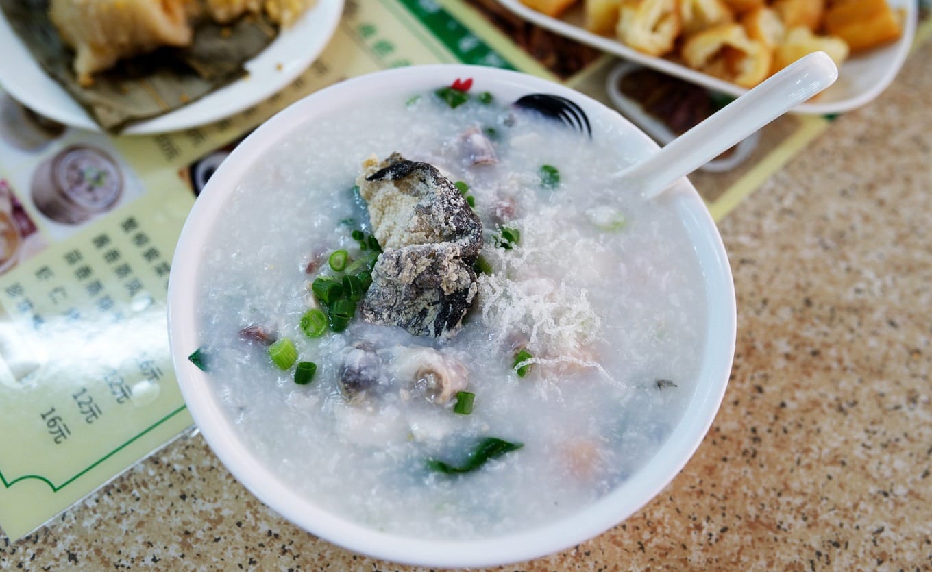 A bowl of Daojiao Fish Porridge with selected ingredients