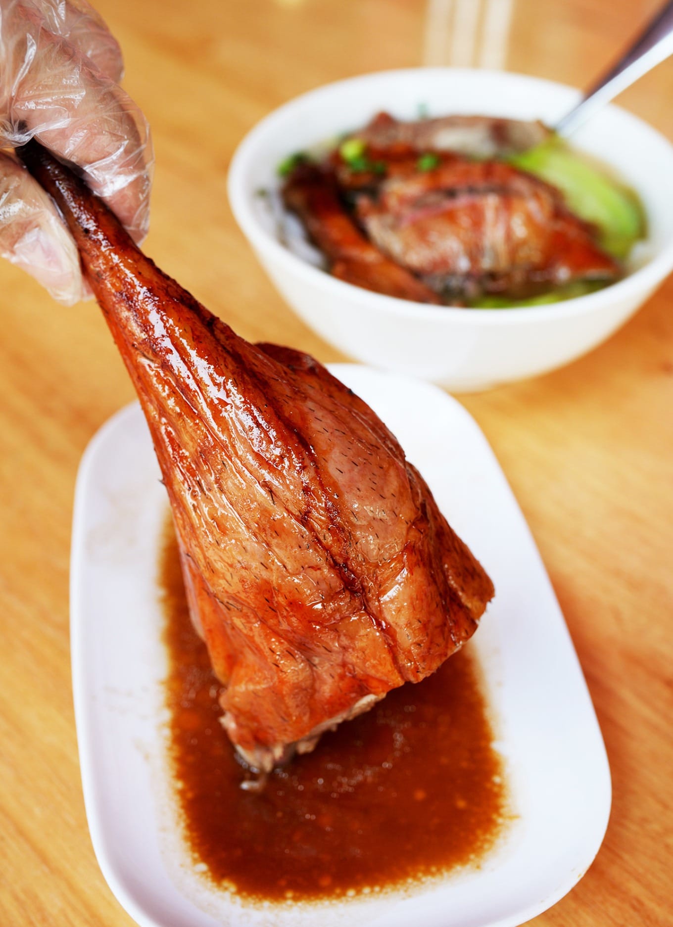 A delectable presentation of roasted goose leg served at Quanji Dongguan Shao E