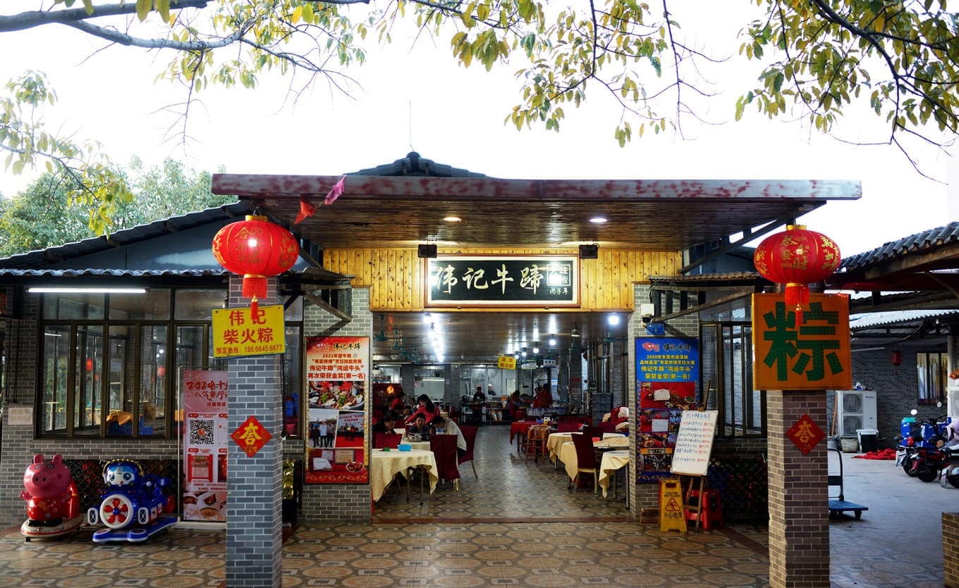 A bustling dining area filled with patrons enjoying the famous beef hoof dish