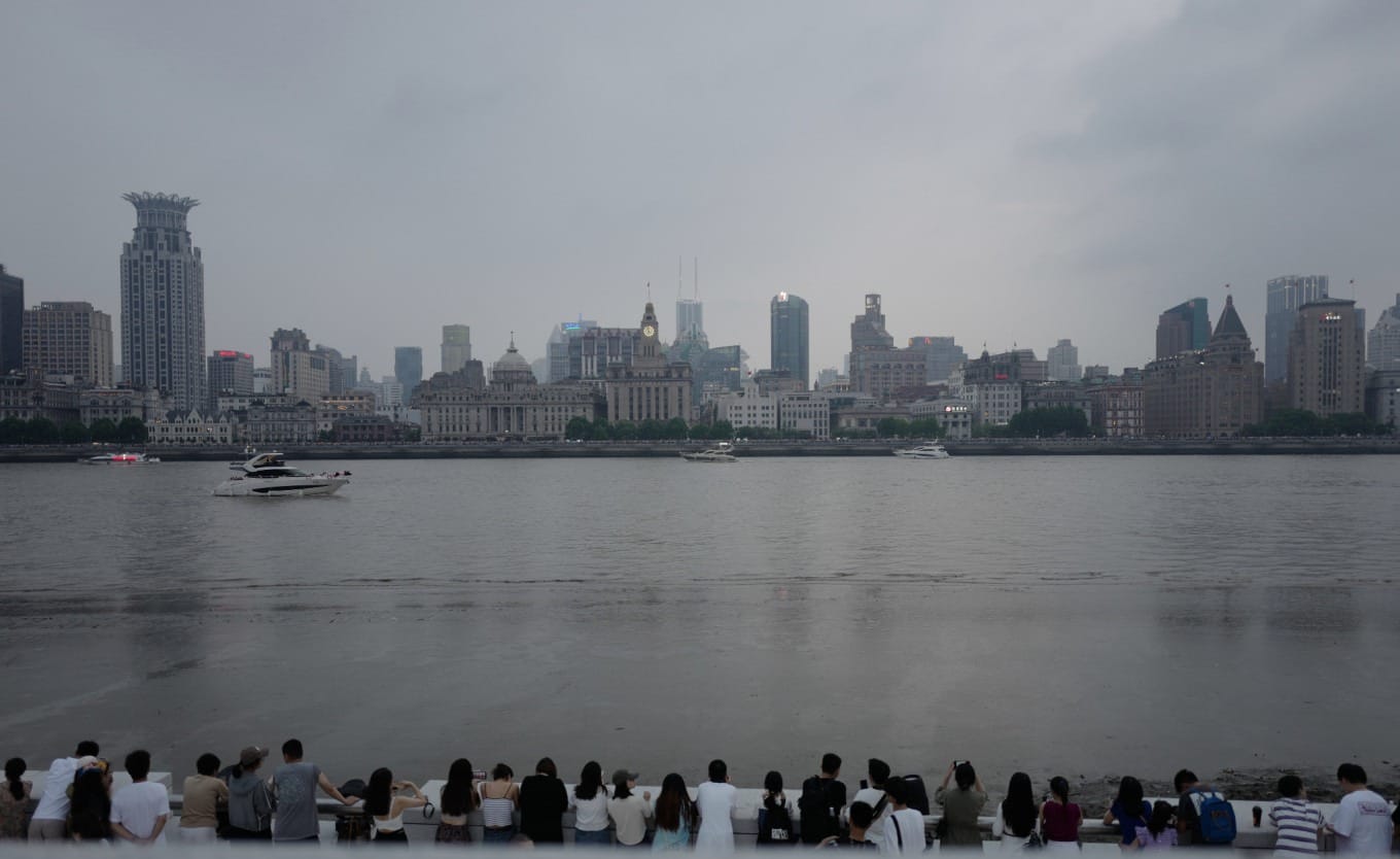 Viewing platform in front of Pudong Art Museum with tripod setup for photography