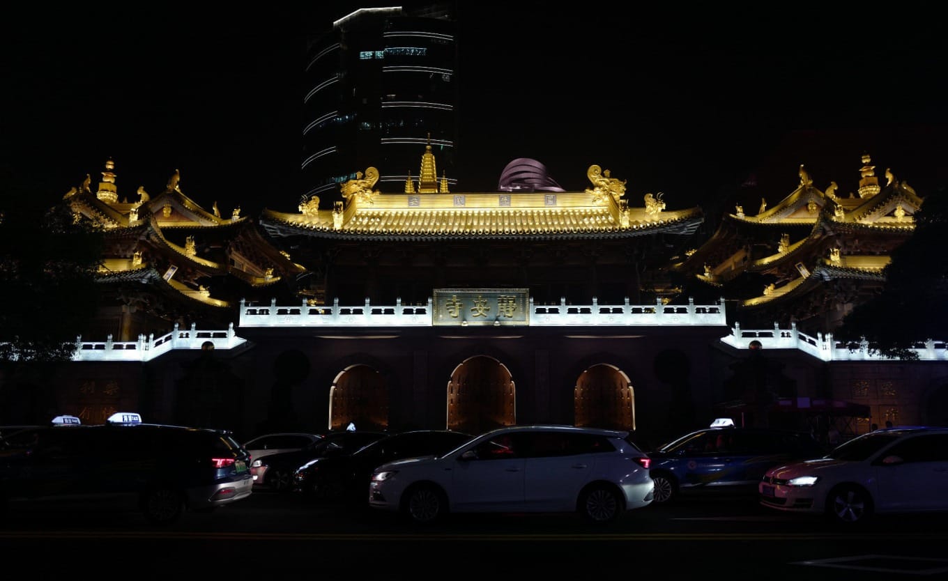 The golden facade of Jing'an Temple illuminated at night