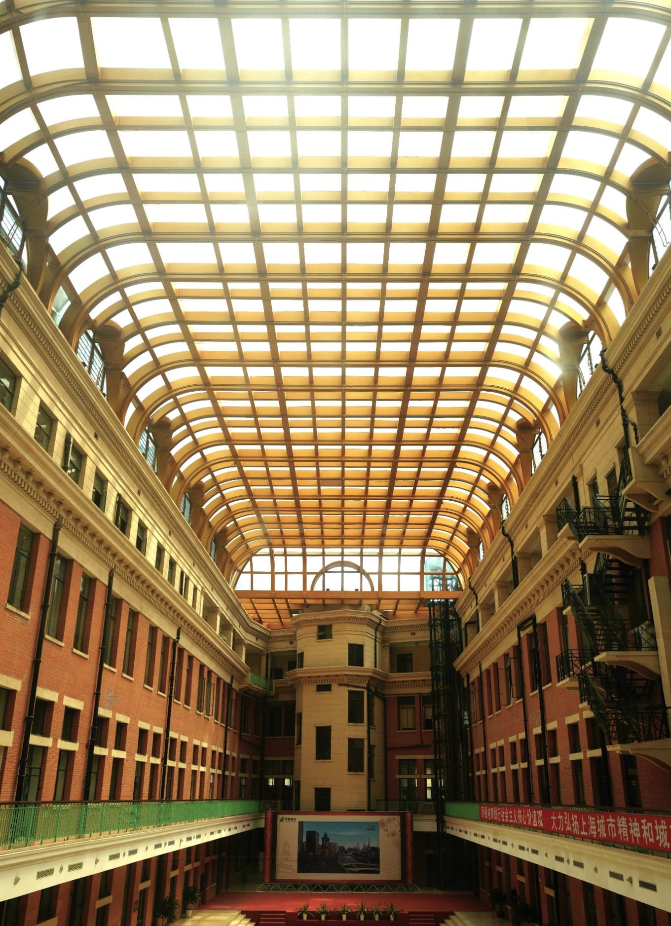 View from inside the museum elevator looking out through tinted glass