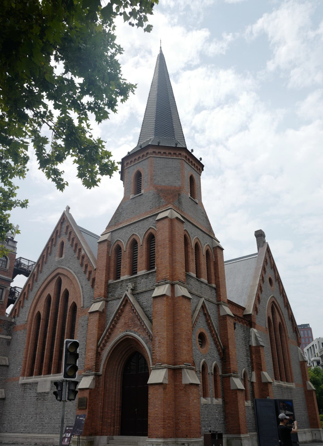 Interior view of New Union Church with stained glass and wooden beams