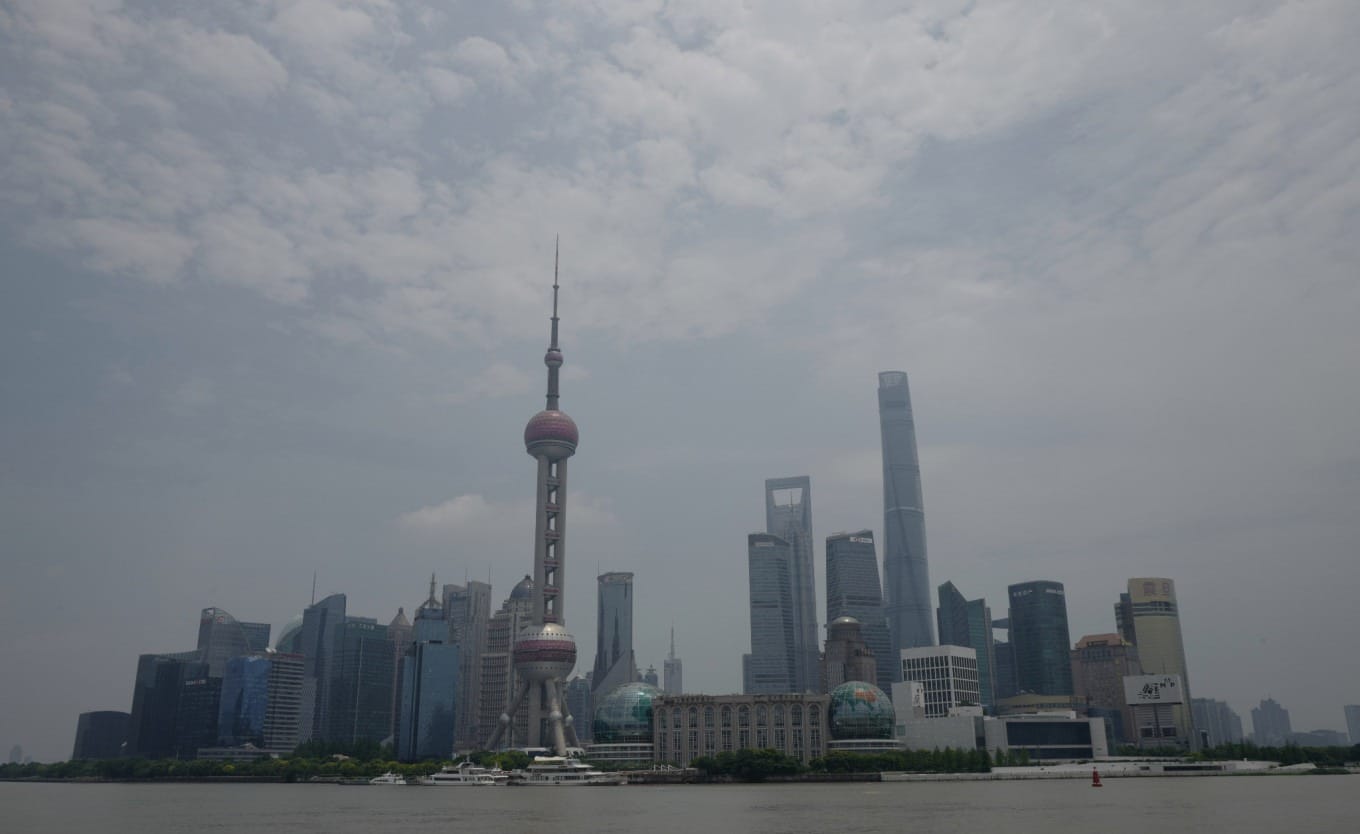 Close-up view of the Monument to the People's Heroes with Huangpu River in background