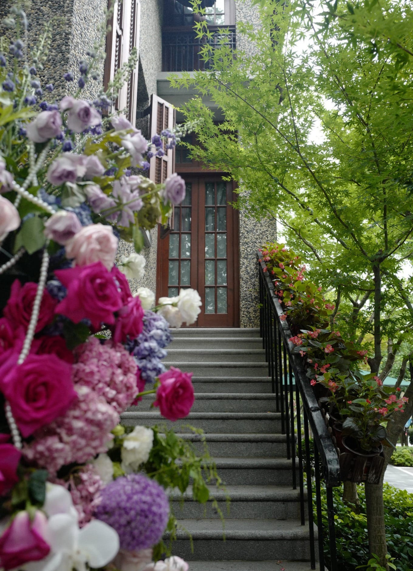 Elegant restaurant entrance at 51 Sinan Road decorated with elaborate floral arrangements