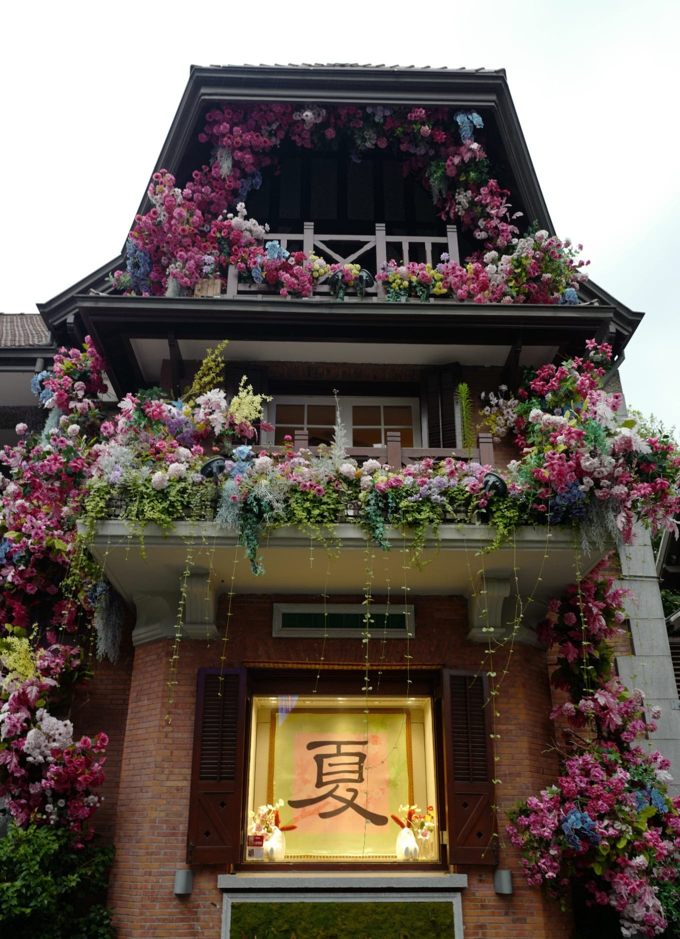 Bustling commercial street section of Sinan Road with shops on both sides