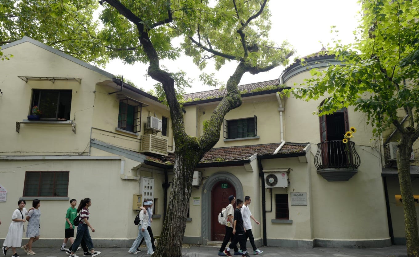 Sunflowers placed on the balcony railing at 129 Wukang Road