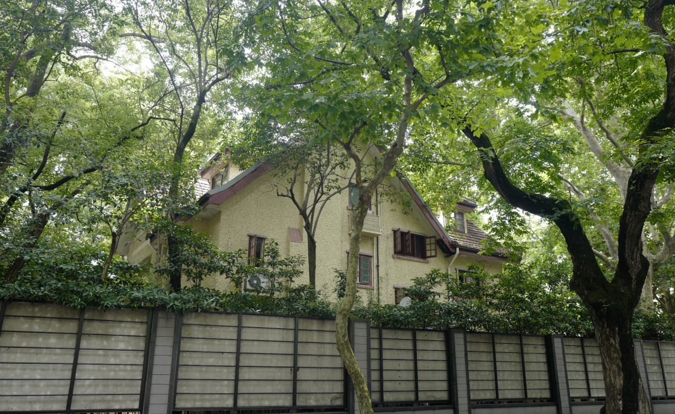 A shared bicycle parked on a quiet street near Wukang Road