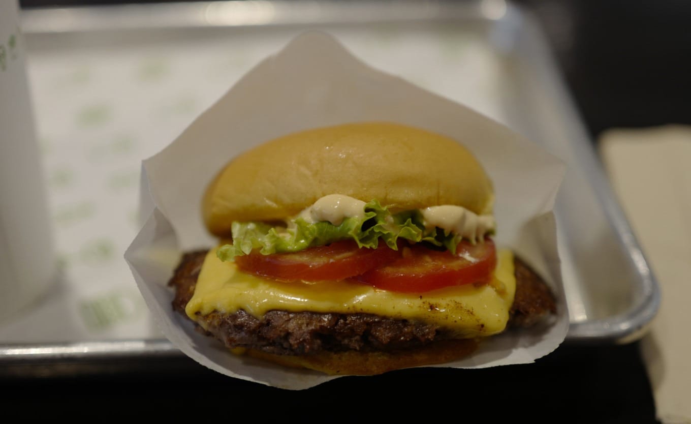 Exterior view of a Shake Shack restaurant in a Shanghai shopping mall