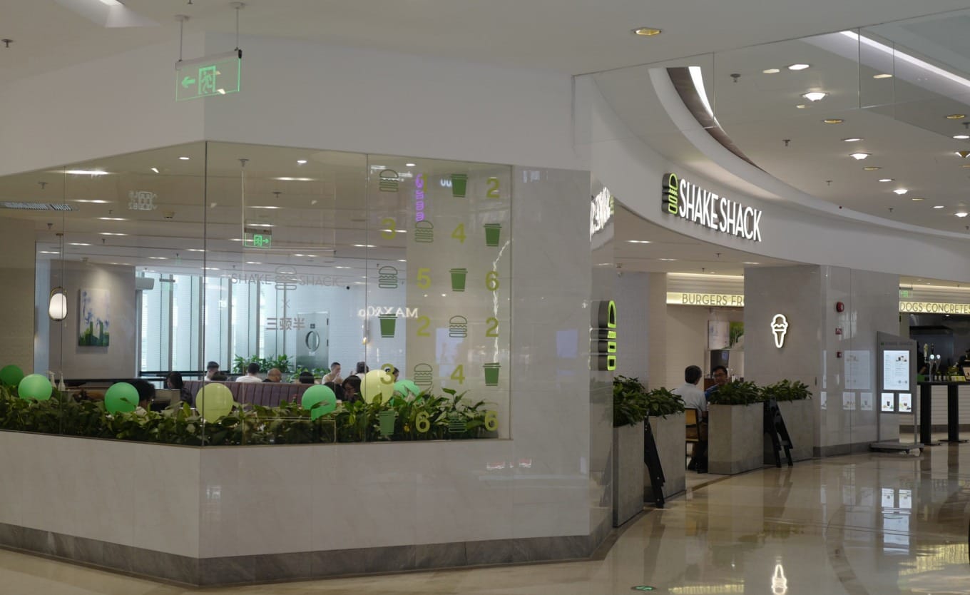 Interior seating area of a Shake Shack restaurant