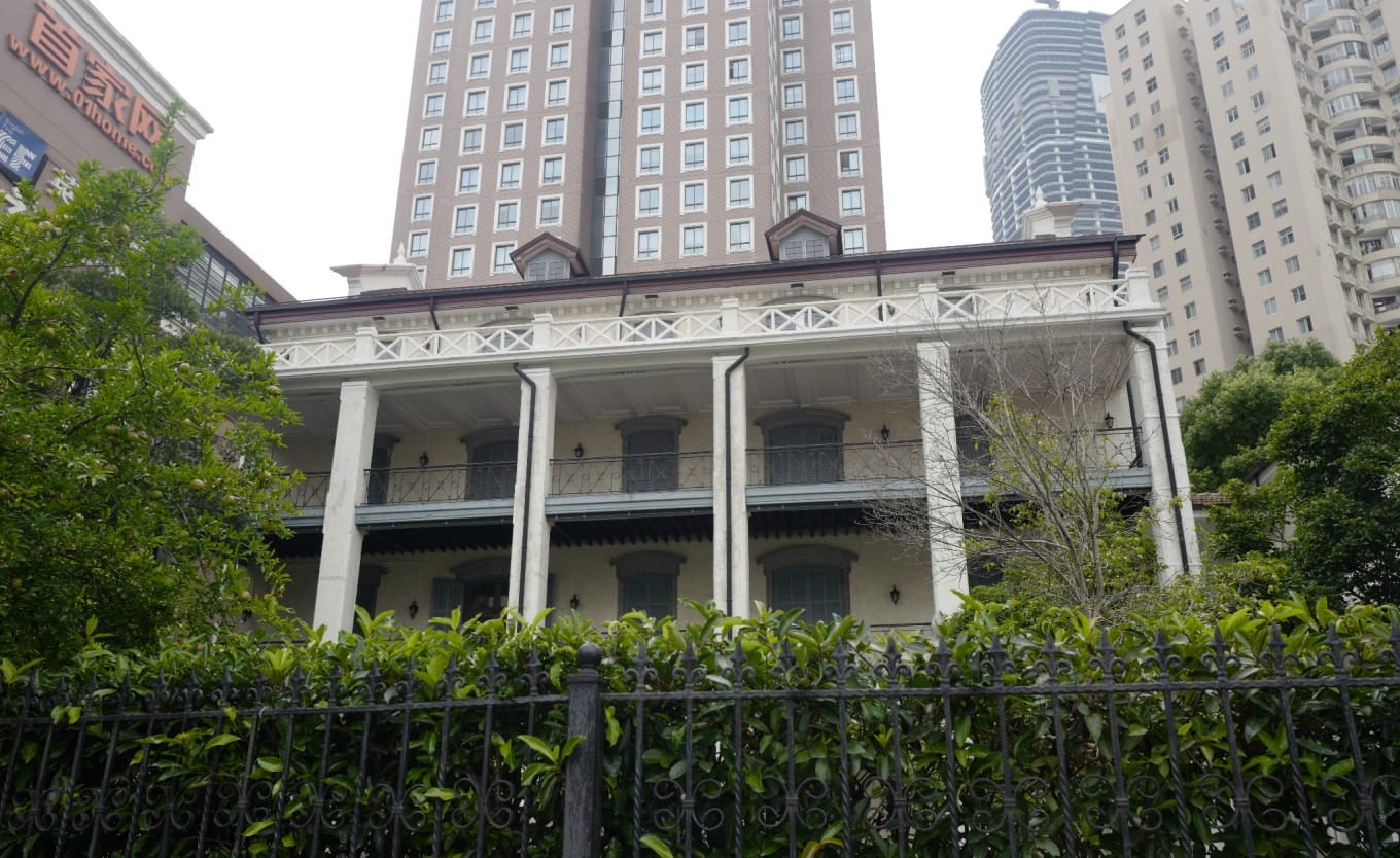 Exterior view of the white Xujiahui Library (Xu Jia Hui Cang Shu Lou) building