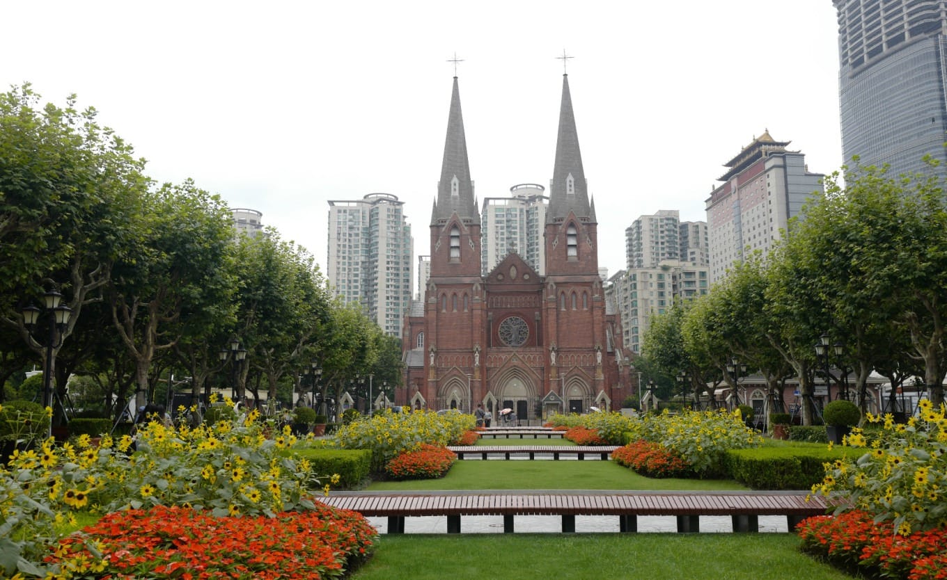 The landscaped lawns and benches in front of the Xujiahui Catholic Church