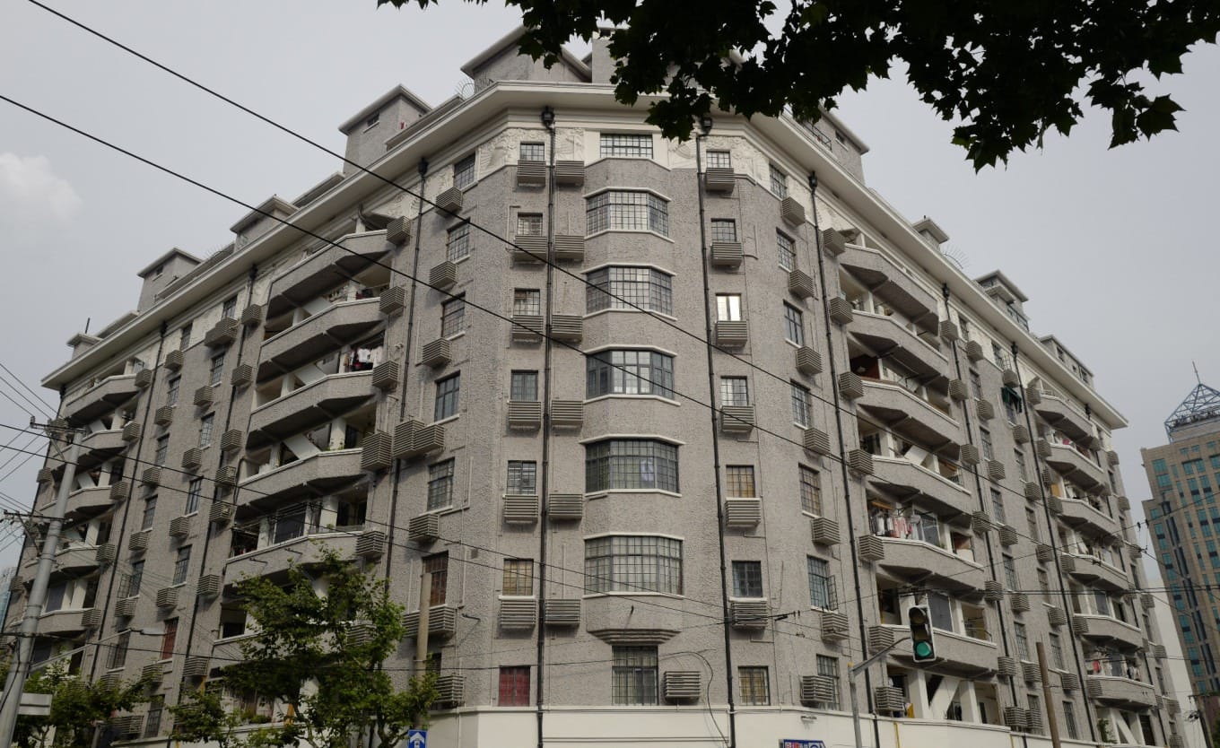Canopy of London plane trees, known as French Parasol trees, shading a Shanghai street