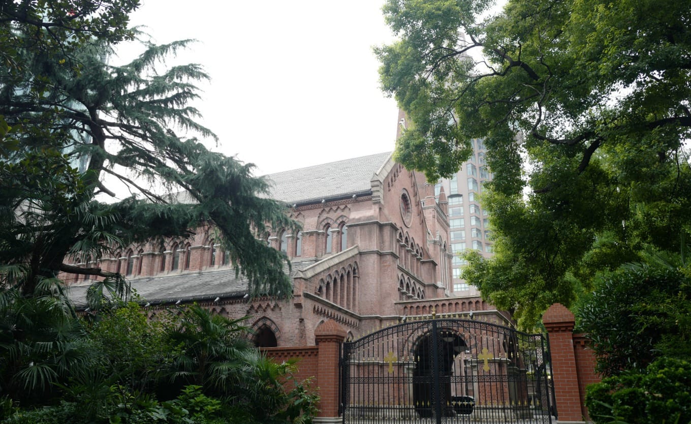 Historic Holy Trinity Church with red brick facade on The Bund in Shanghai