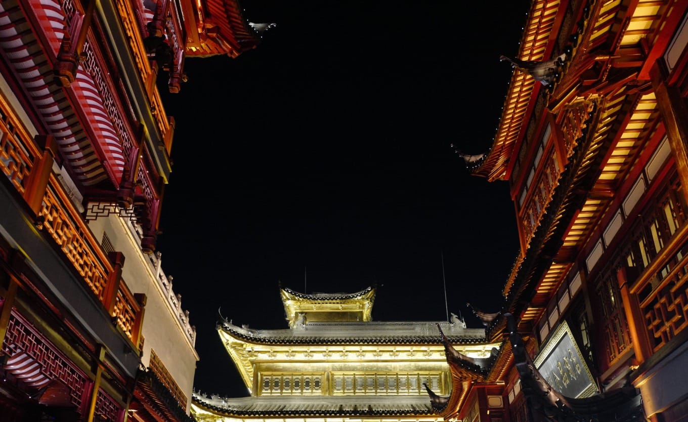 Colorful traditional decorations and lanterns along a walkway in Yuyuan