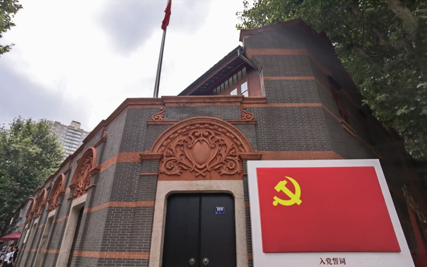 Historical photograph showing the contrast between old Shanghai's Bund area and its poorer districts