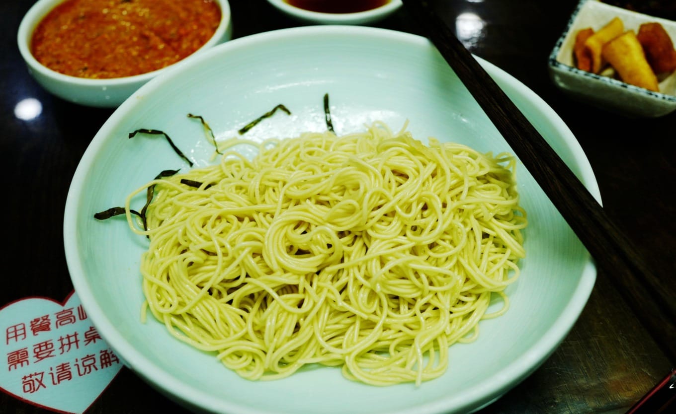 Interior view of Yuxingji Noodle House showing traditional decor