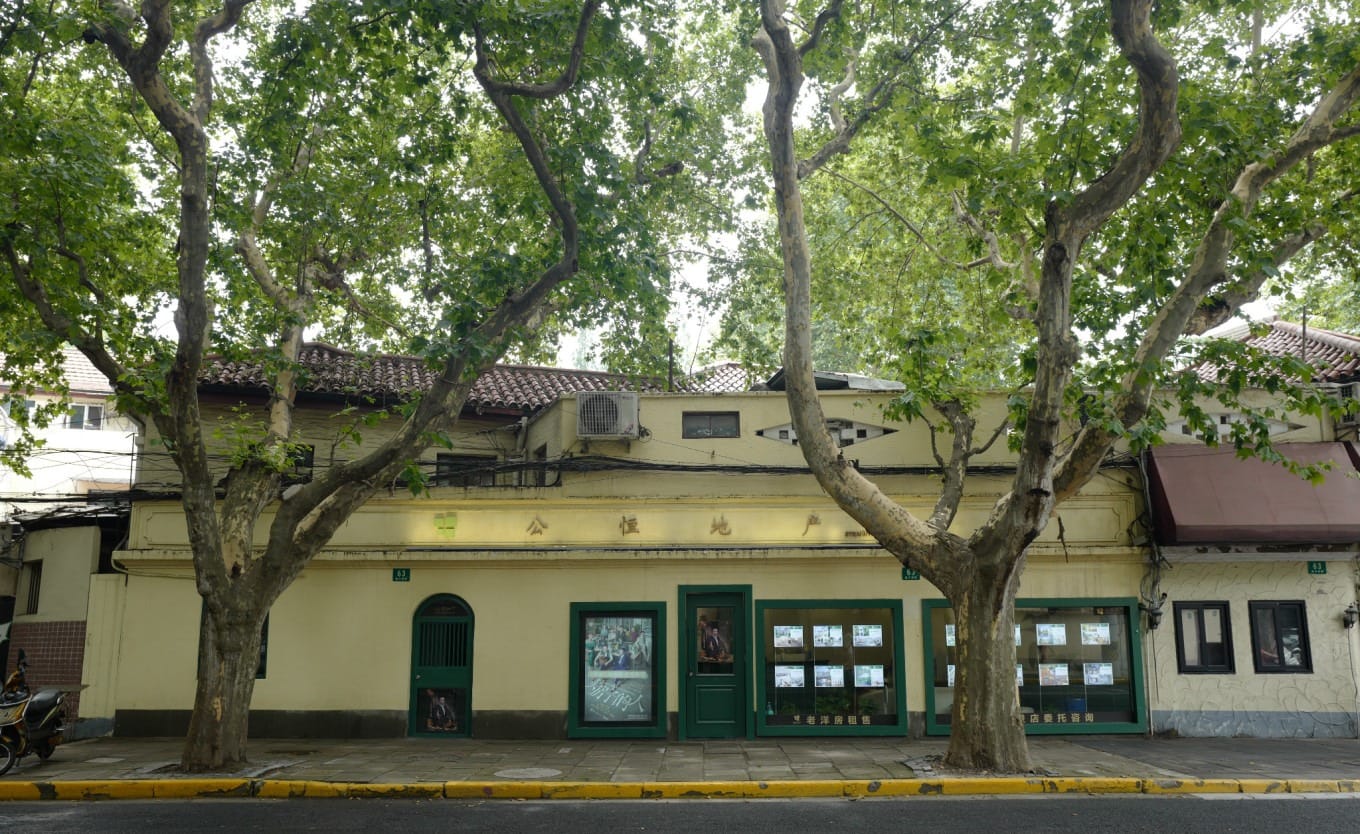 Storefront of a real estate agency at 63 Fuxing West Road