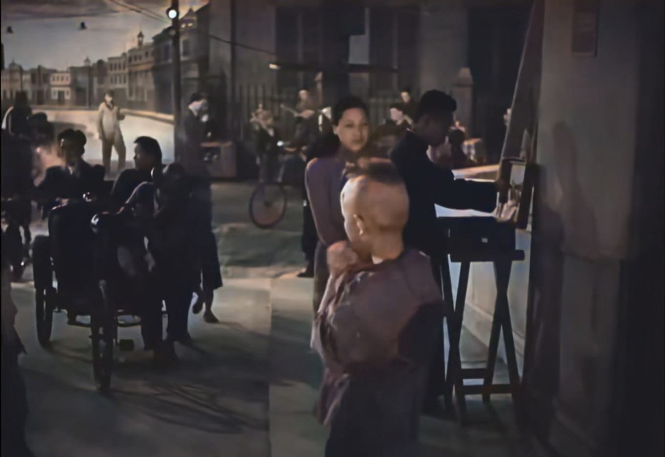 Pedestrians walking along The Bund promenade