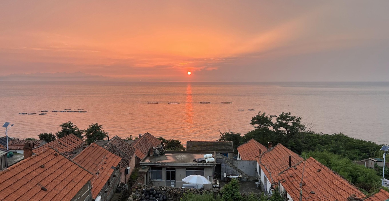 Silhouette of lighthouse at sunset