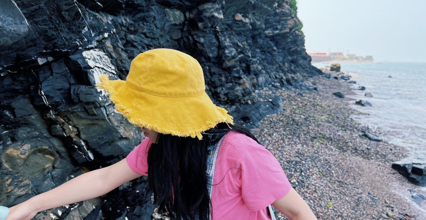 Tourist standing near the rock formation