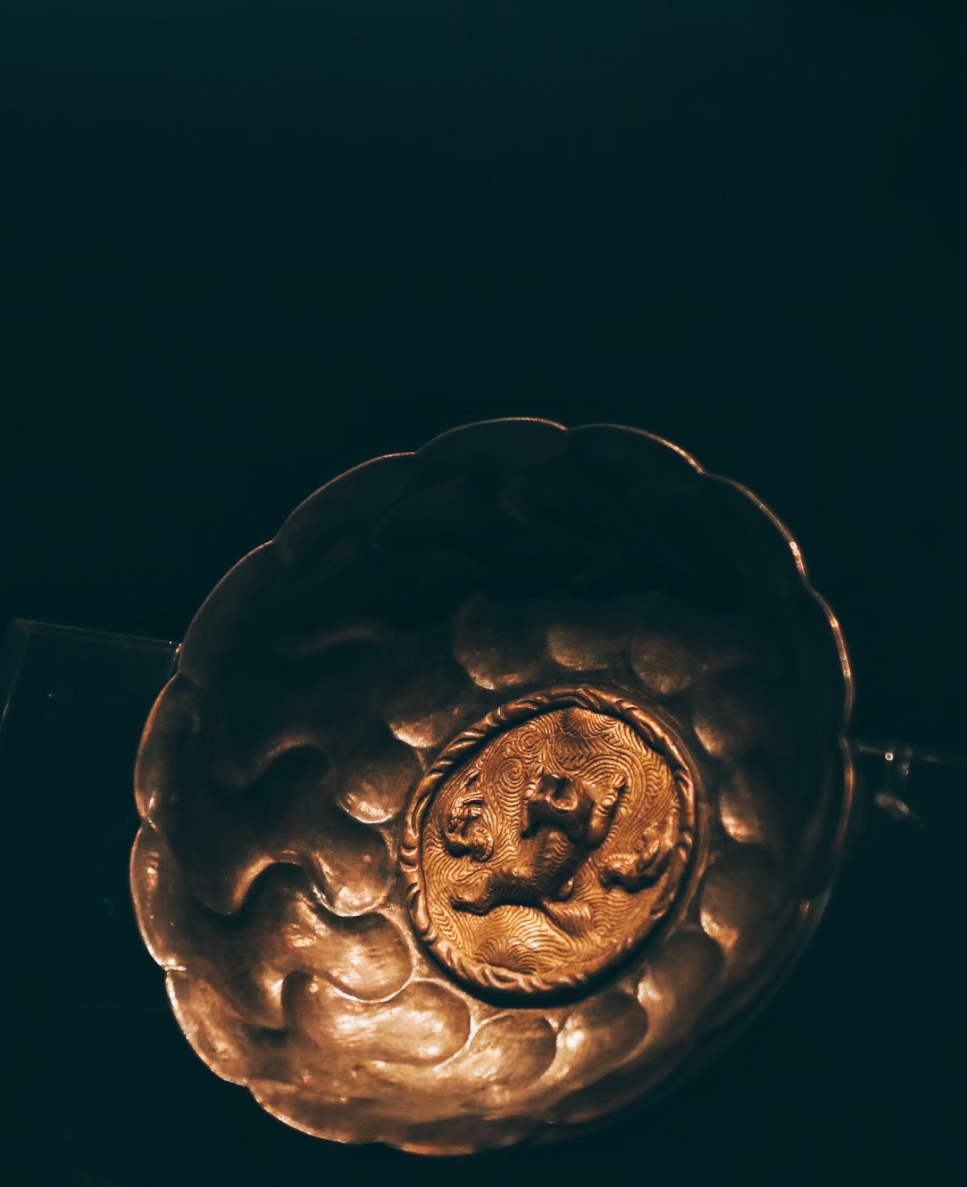 Gilt silver bowl with sea creatures and water wave pattern from Tang dynasty