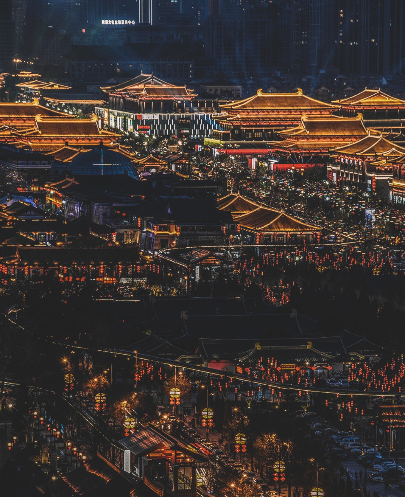Performers in Tang dynasty costumes dancing under lanterns
